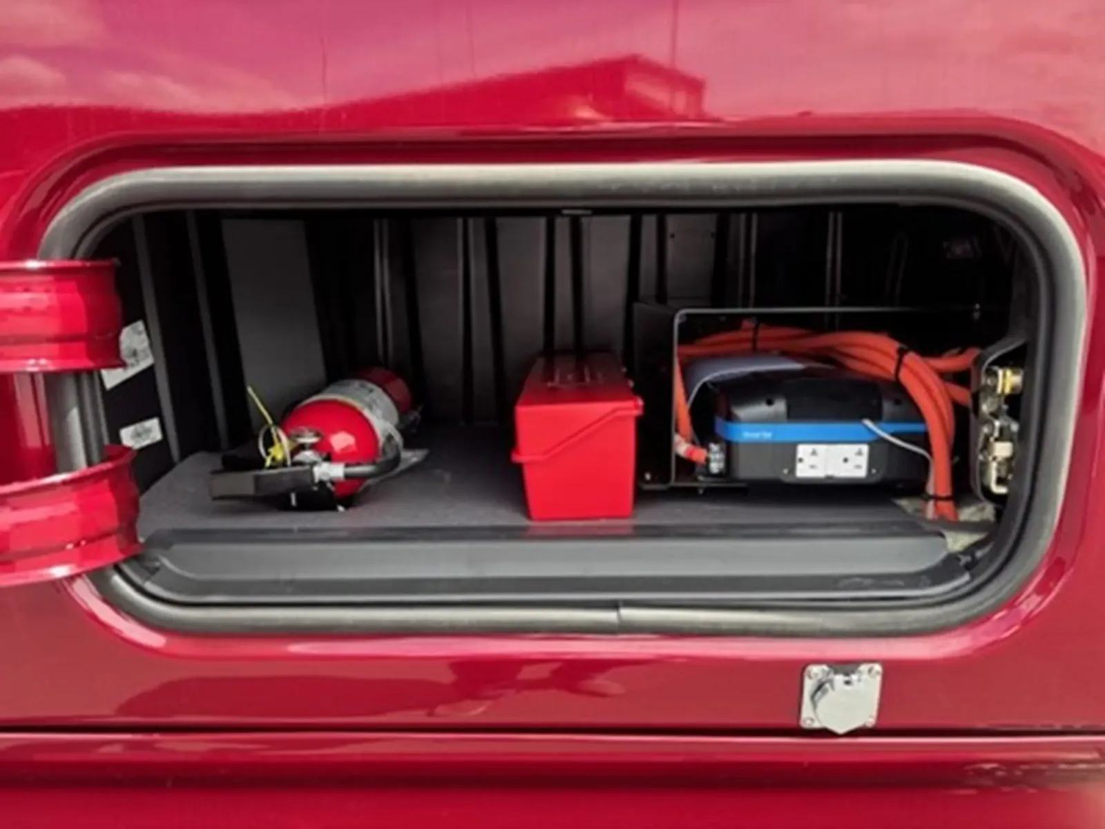 Side storage box with inverter and fire extinguisher